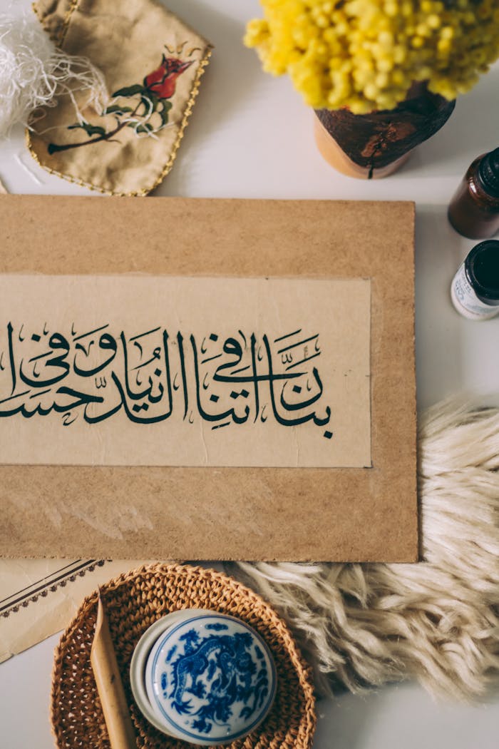 Artistic Arabic calligraphy surrounded by traditional decor elements
